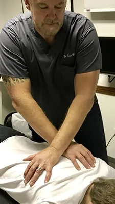 Dr. Eric Miller performing a back adjustment