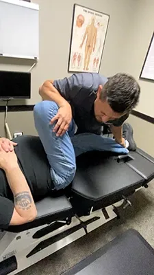 Dr. Eric Miller performing a leg adjustment