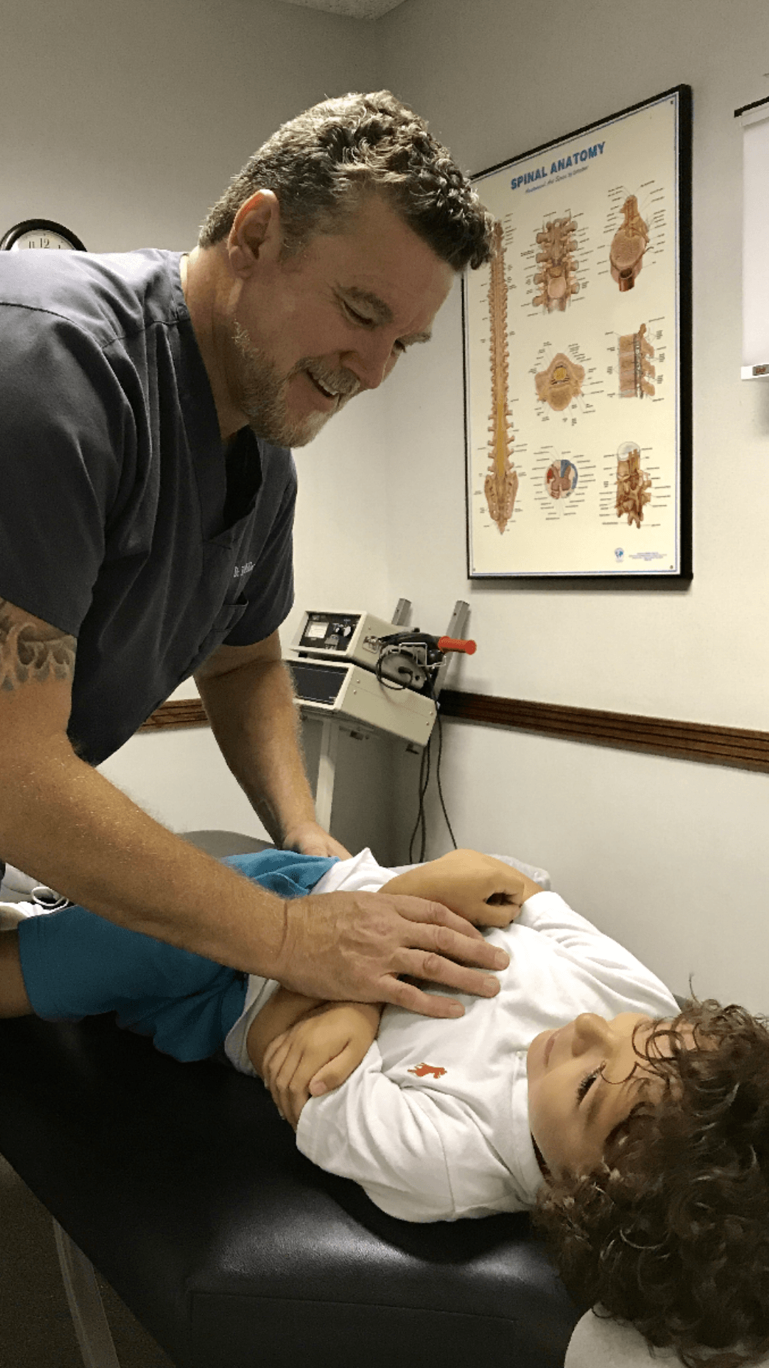 Dr. Eric Miller performing a chiropractic adjustment