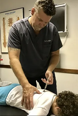 Dr. Eric Miller treating a young patient