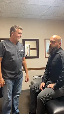 Dr. Eric Miller consulting with a patient
