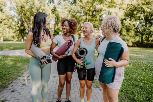 A diverse, supportive community walking together with wellness gear
